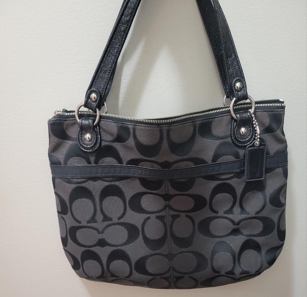 Coach large black signature shoulder bag with patent leather straps.